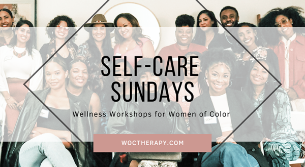 Diverse group of smiling people at a 'self-care sundays' therapy workshop for women of color at a wellness center in California.